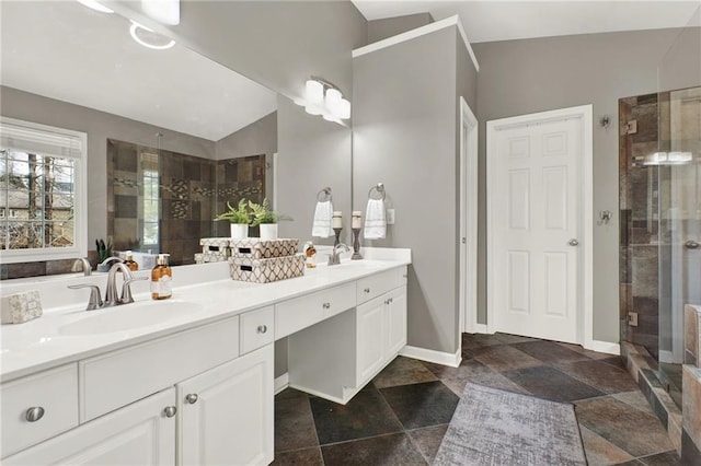 bathroom featuring vanity, an enclosed shower, and vaulted ceiling