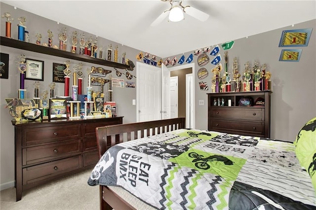 bedroom featuring light carpet and ceiling fan