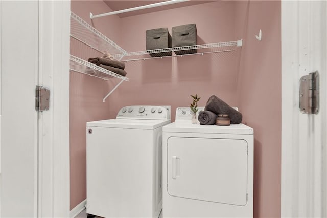 laundry room with separate washer and dryer