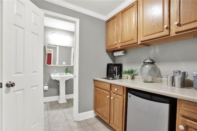 kitchen with light tile patterned flooring, sink, fridge, and ornamental molding