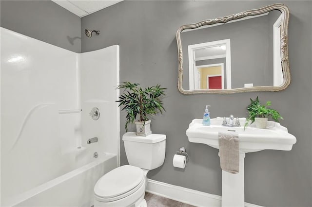 full bathroom featuring sink, shower / tub combination, and toilet