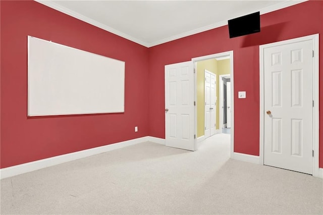 unfurnished bedroom featuring ornamental molding and carpet flooring