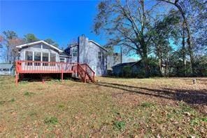 view of yard with a wooden deck and stairs