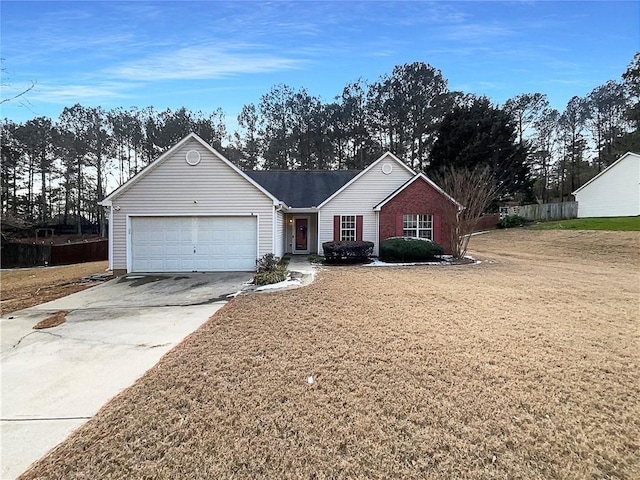 single story home with a garage and a front yard