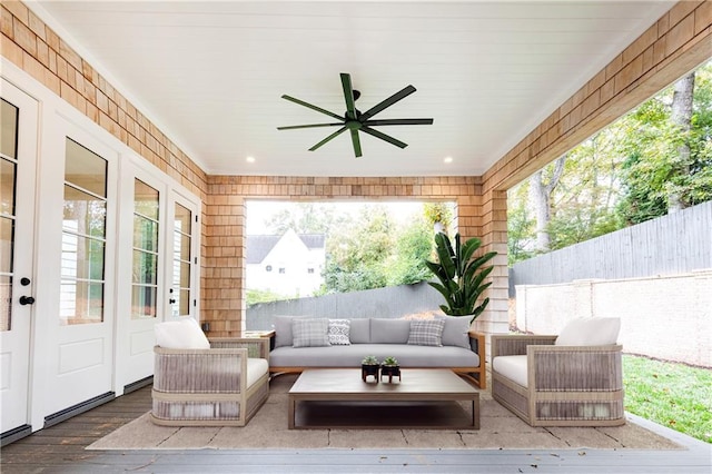 view of patio with an outdoor living space and ceiling fan