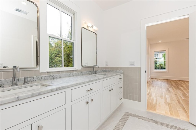 bathroom with tile patterned flooring and vanity