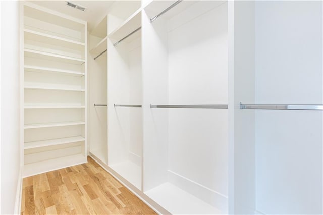 walk in closet featuring wood-type flooring