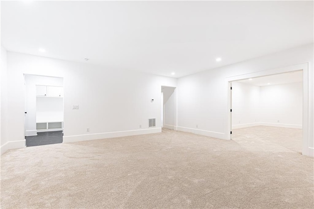 empty room featuring light carpet