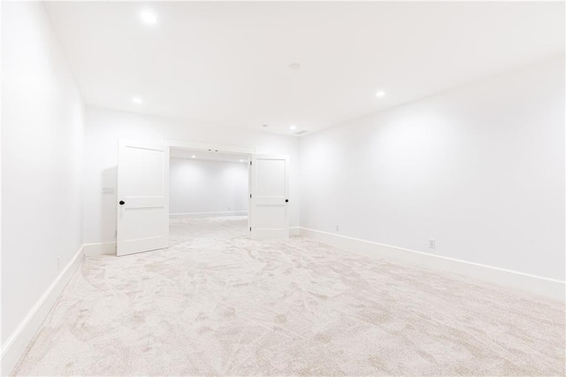 empty room featuring light carpet