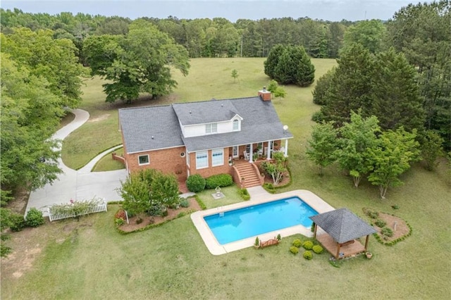 7174 Rockmart Rd, Silver Creek, GA 30173 - rear view of property featuring stairway, a lawn, a view of trees, and an outdoor pool