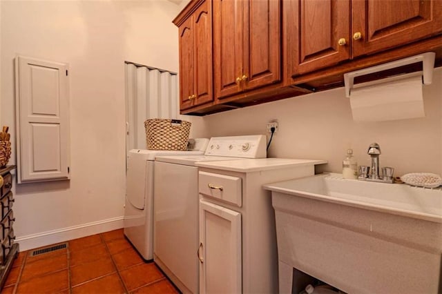 7174 Rockmart Rd, Silver Creek, GA 30173 - laundry room featuring a sink, cabinet space, visible vents, dark tile patterned flooring, and washing machine and dryer