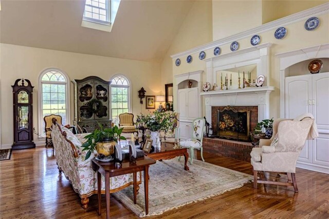 7174 Rockmart Rd, Silver Creek, GA 30173 - living room featuring wood finished floors, a fireplace, a skylight, and high vaulted ceiling