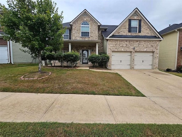 view of front of property featuring a garage and a front lawn