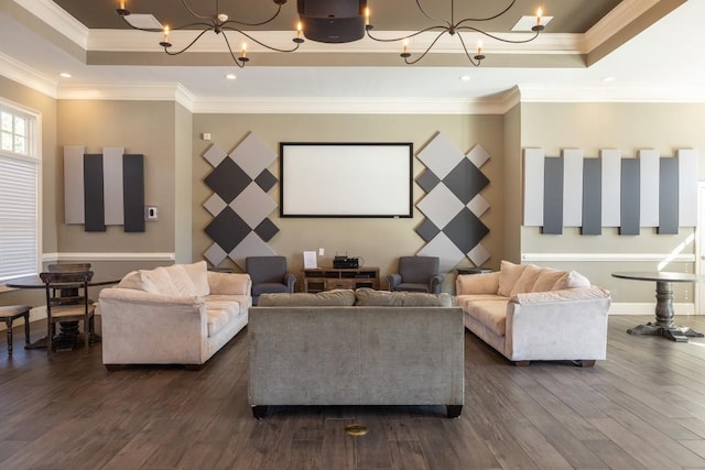 living room with an inviting chandelier, crown molding, dark hardwood / wood-style flooring, and a raised ceiling