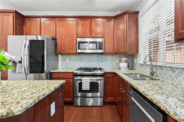 2343 Limehurst Dr NE, Atlanta, GA 30319 - kitchen featuring stainless steel appliances, dark wood-type flooring, light stone countertops, ornamental molding, and backsplash