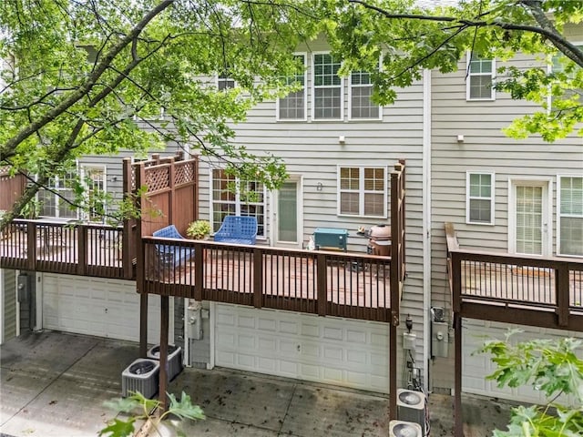 2343 Limehurst Dr NE, Atlanta, GA 30319 - back of house featuring an attached garage, driveway, and a wooden deck