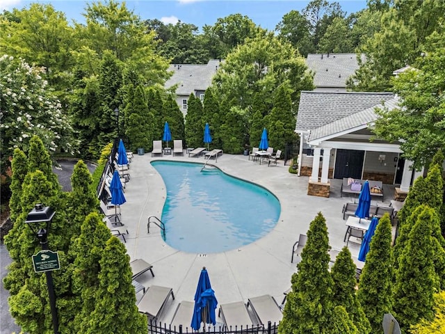 2343 Limehurst Dr NE, Atlanta, GA 30319 - community pool with a patio area and view of wooded area