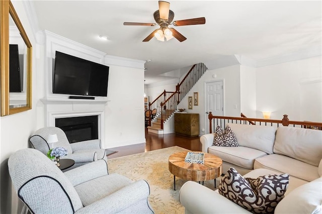 2343 Limehurst Dr NE, Atlanta, GA 30319 - living room with ceiling fan, stairs, wood finished floors, and a glass covered fireplace