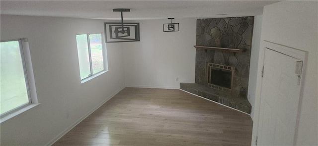 991 Park Creek Cir, Lawrenceville, GA 30044 - unfurnished living room with wood finished floors, a fireplace, and baseboards