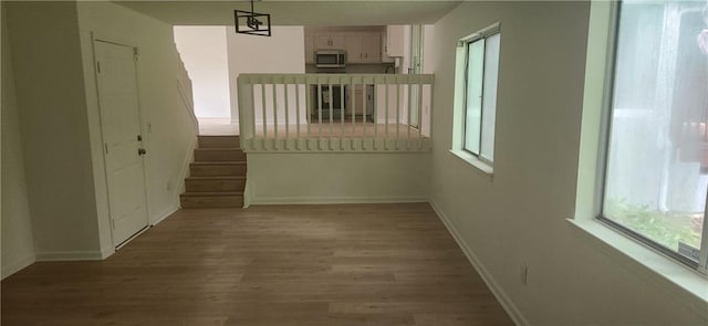 991 Park Creek Cir, Lawrenceville, GA 30044 - unfurnished room featuring wood finished floors, baseboards, and stairway