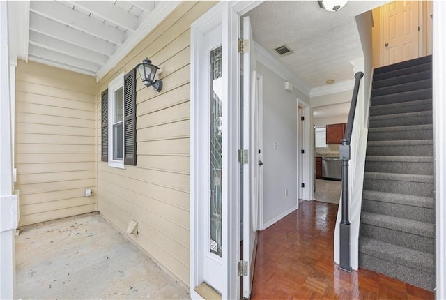 property entrance featuring visible vents