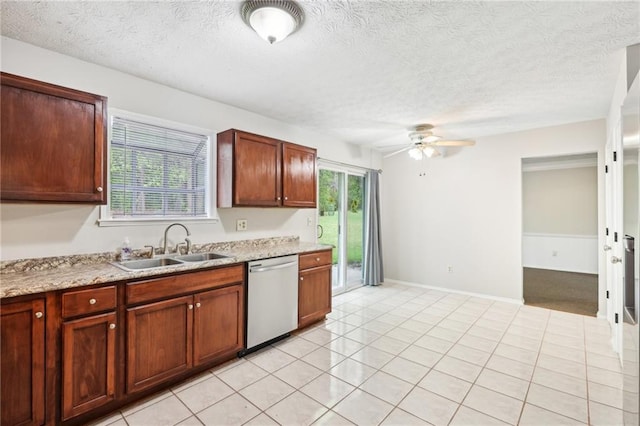 kitchen featuring dishwasher, light countertops, a sink, and ceiling fan