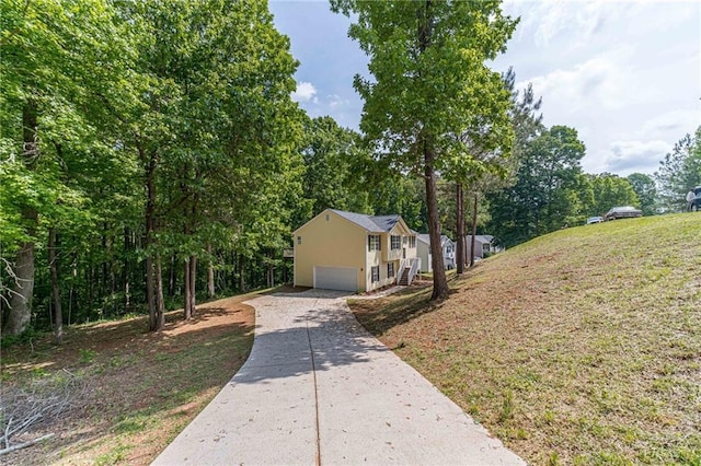 view of side of home featuring a garage