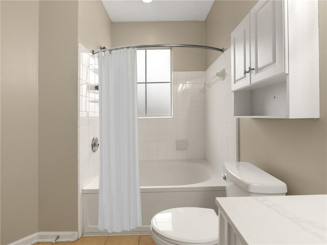 full bath featuring toilet, shower / bath combination with curtain, tile patterned flooring, baseboards, and vanity