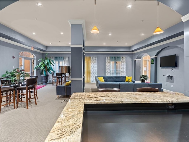 living area with recessed lighting and light colored carpet