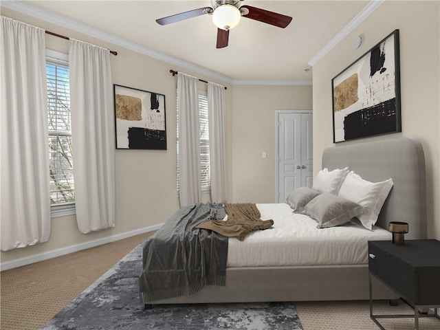 bedroom featuring ceiling fan, baseboards, carpet floors, and ornamental molding