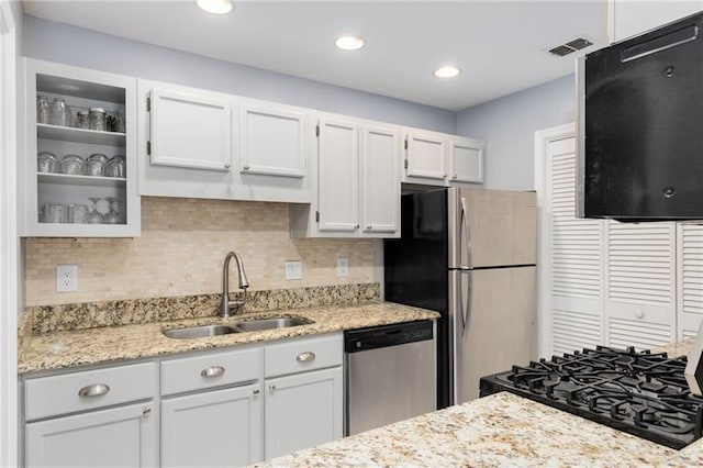 303 Gettysburg Pl, Atlanta, GA 30350 - kitchen with appliances with stainless steel finishes, a sink, glass insert cabinets, white cabinets, and recessed lighting