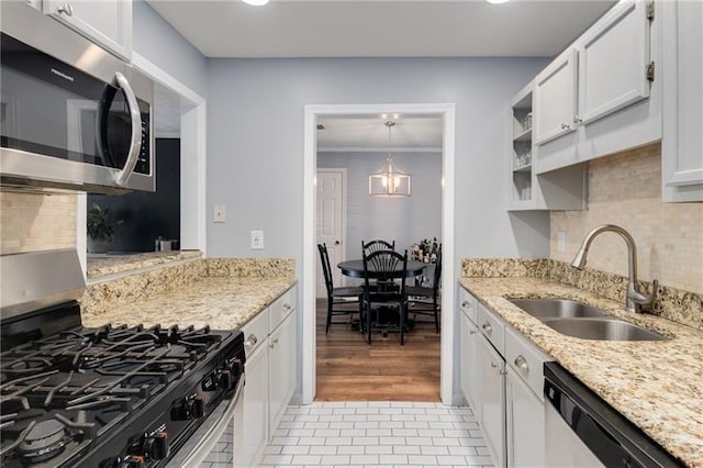 303 Gettysburg Pl, Atlanta, GA 30350 - kitchen featuring appliances with stainless steel finishes, a sink, tasteful backsplash, white cabinets, and recessed lighting