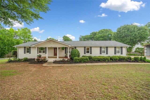 3415 Trickum Rd, Woodstock, GA 30188 - ranch-style house with covered porch, a front yard, and brick siding