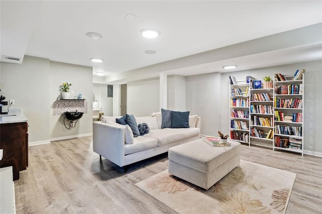 3415 Trickum Rd, Woodstock, GA 30188 - living area featuring light wood-style flooring and baseboards