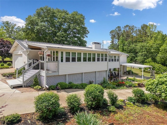 3415 Trickum Rd, Woodstock, GA 30188 - back of property featuring a chimney, a porch, and a garage