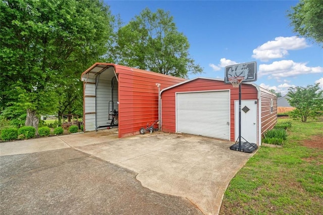 3415 Trickum Rd, Woodstock, GA 30188 - detached garage featuring concrete driveway and a carport