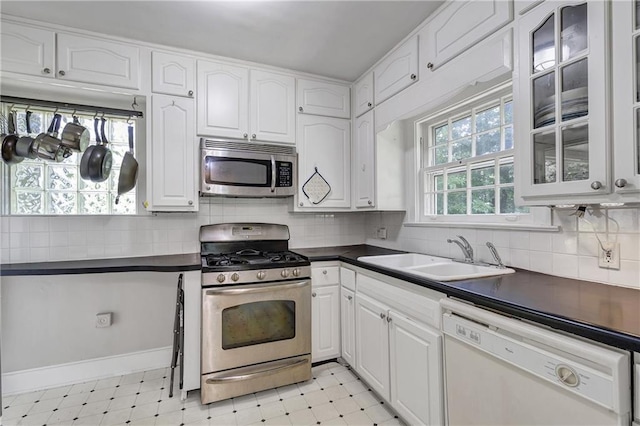1908 E Roxboro Rd NE, Atlanta, GA 30324 - kitchen with stainless steel appliances, dark countertops, and light floors