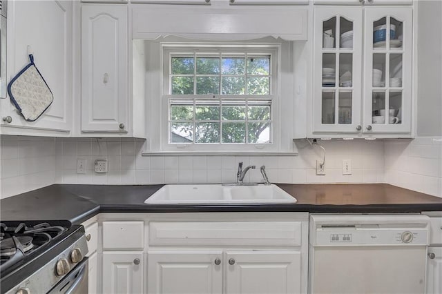 1908 E Roxboro Rd NE, Atlanta, GA 30324 - kitchen featuring dishwasher, dark countertops, white cabinets, and glass insert cabinets