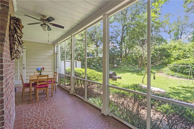 1908 E Roxboro Rd NE, Atlanta, GA 30324 - sunroom / solarium featuring a ceiling fan, outdoor dining space, and view of scattered trees