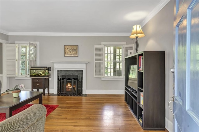 1908 E Roxboro Rd NE, Atlanta, GA 30324 - living room featuring a tile fireplace, ornamental molding, and wood finished floors