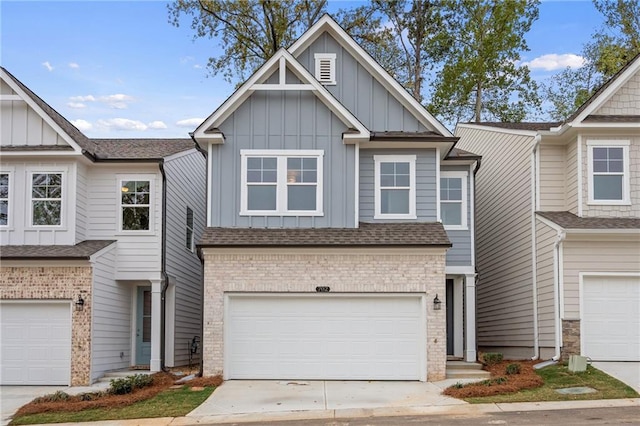 702 Smokey Quartz Way, Kennesaw, GA 30144 - view of property with board and batten siding, brick siding, an attached garage, and driveway