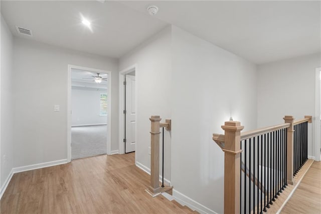 702 Smokey Quartz Way, Kennesaw, GA 30144 - hall featuring an upstairs landing, baseboards, and light wood-style flooring