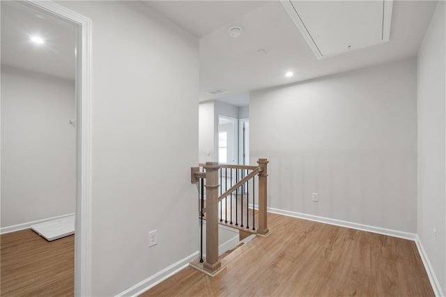 702 Smokey Quartz Way, Kennesaw, GA 30144 - corridor with attic access, an upstairs landing, wood finished floors, baseboards, and recessed lighting
