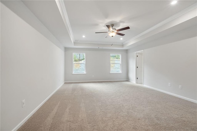 702 Smokey Quartz Way, Kennesaw, GA 30144 - unfurnished room with ceiling fan, a tray ceiling, ornamental molding, baseboards, and light colored carpet