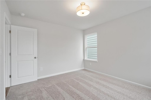 702 Smokey Quartz Way, Kennesaw, GA 30144 - carpeted spare room featuring a smoke detector and baseboards