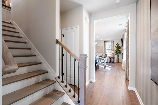 702 Smokey Quartz Way, Kennesaw, GA 30144 - staircase with wood finished floors and baseboards