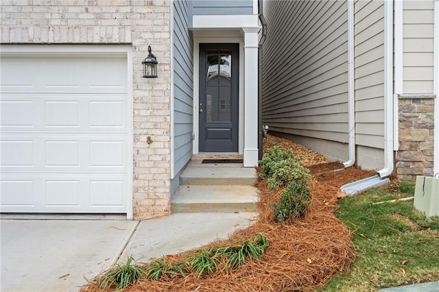 702 Smokey Quartz Way, Kennesaw, GA 30144 - doorway to property featuring brick siding and an attached garage
