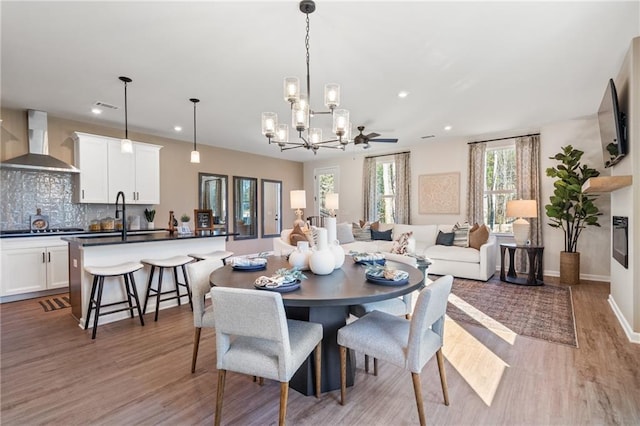 702 Smokey Quartz Way, Kennesaw, GA 30144 - dining room with a chandelier, light wood-type flooring, recessed lighting, and baseboards