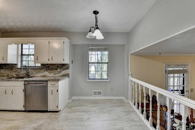 kitchen with a sink, white cabinetry, visible vents, and dishwasher