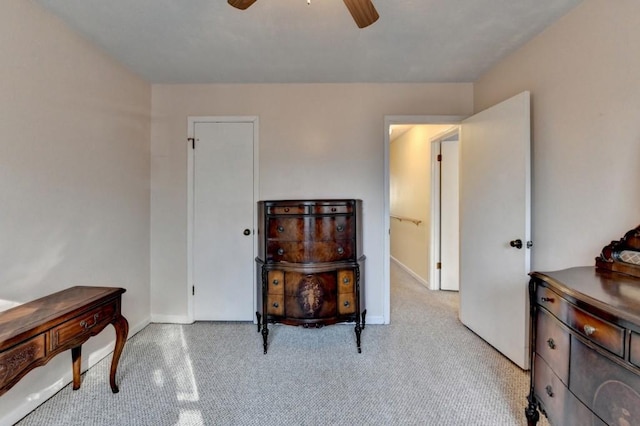 interior space featuring ceiling fan and baseboards